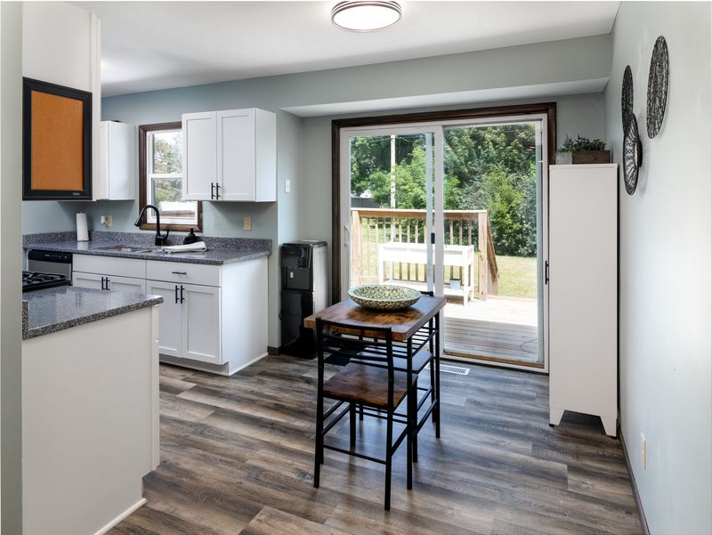 Kitchen dining area with slider to the backyard deck