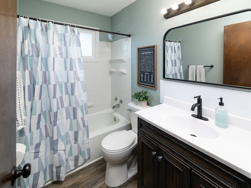 Refreshed main-floor full bath with tub/shower & updated fixtures