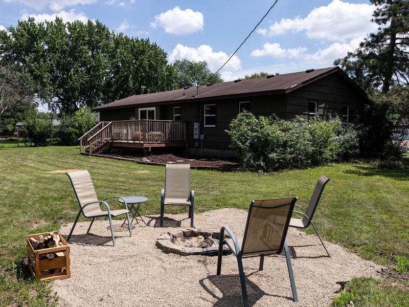 Pea-gravel fire pit patio just steps from the deck