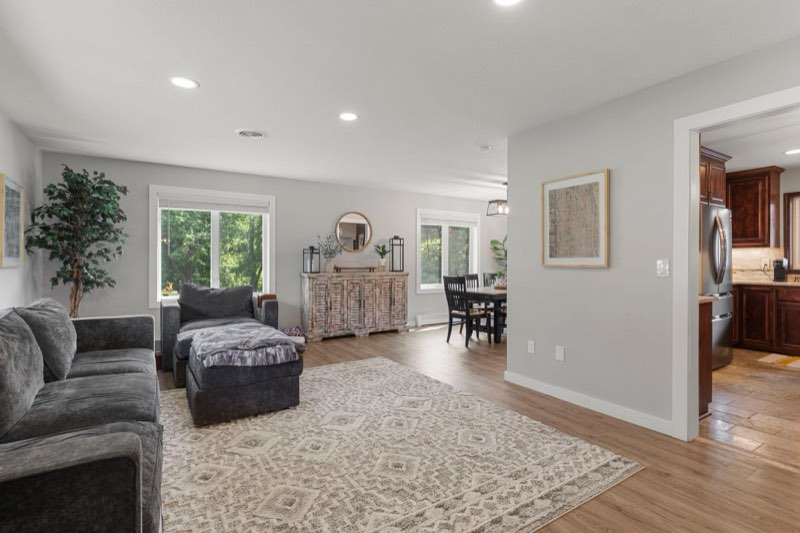 The main level offers a comfortable living room that flows into the dining area and kitchen, creating an inviting space