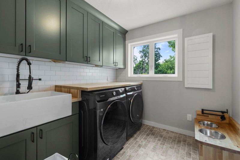 Main level laundry room with impeccable style